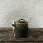 stoneware canister with spoon