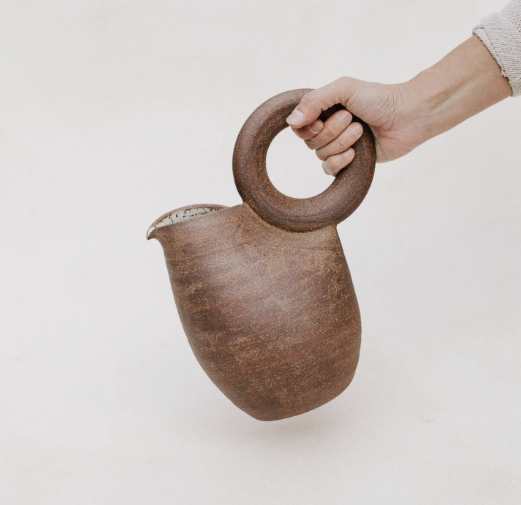 brown ceramic ring pitcher