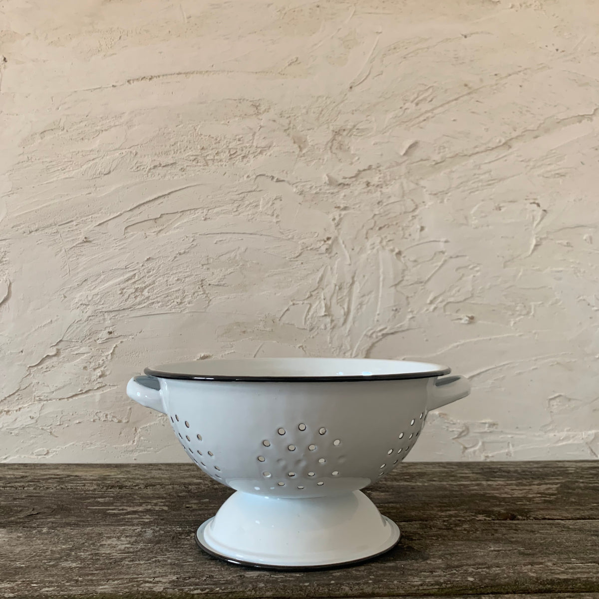 white enamelware colander