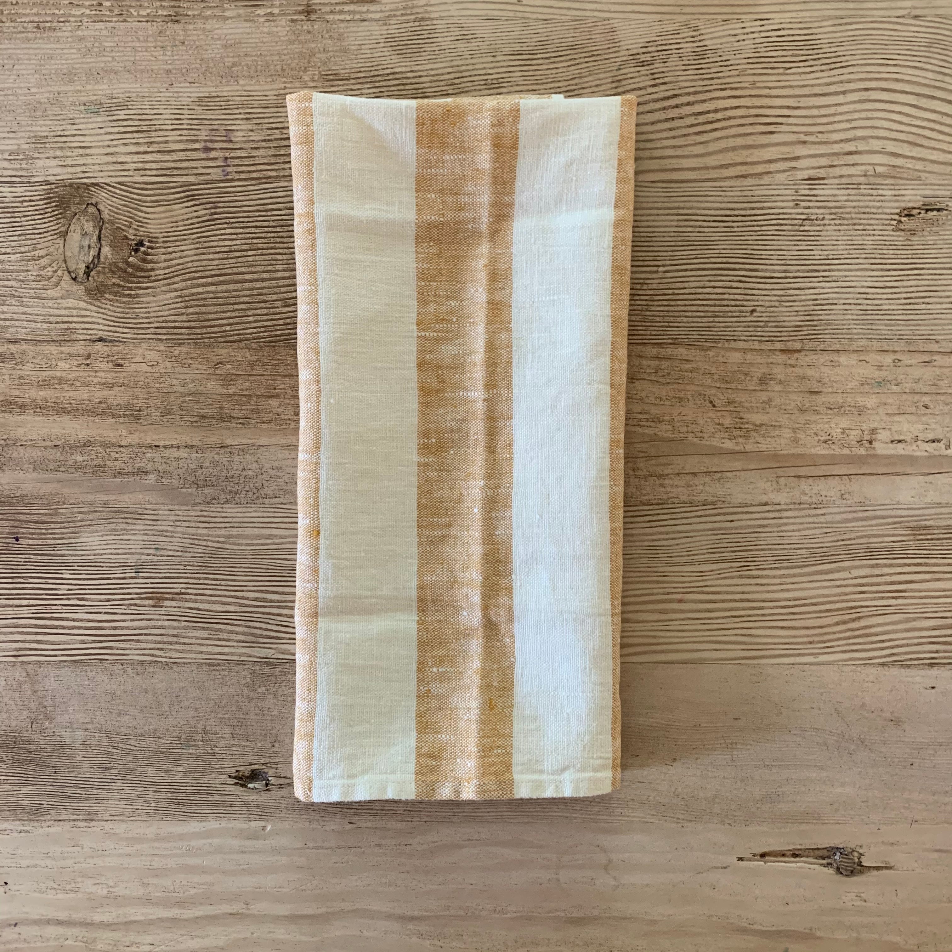 pair of linen hand towels with wide stripes- gold
