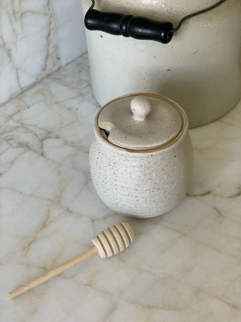 speckled stoneware honey pot with wood dipper